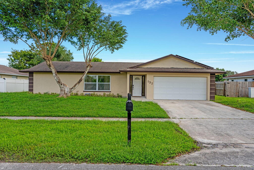 137 Alcazar Street, Royal Palm Beach, FL 33411